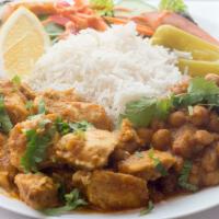 Chicken Curry · Side of basmati rice, chickpeas, and green salad.