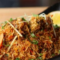 Goat Biryani · Spiced Goat cooked with saffron flavor basmati rice and traditional spices.