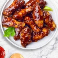 Bbq Buster Wings  · Crispy wings fried until golden brown, and tossed in barbecue sauce. Served with your choice...