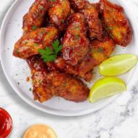 Honey Smokes Wings  · Crispy wings fried until golden brown, and tossed in honey mustard sauce. Served with your c...