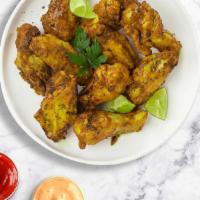 Piper Picked Pepper Wings · Crispy wings fried until golden brown, and tossed in lemon pepper sauce. Served with your ch...