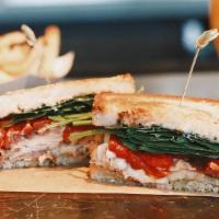 Grilled Mediterranean Turkey Sandwich · proscuitto, roasted red peppers, spinach, provolone, basil pesto mayo, sourdough