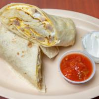 Breakfast Burrito · Made with two eggs, choice of meat, and potato; topped with sour cream and salsa.