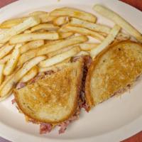 Reuben · Hot corned beef with melted cheese, sauerkraut and Russian dressing on rye bread.