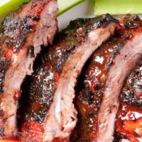 Half Rack St Louis Ribs · Half rack of ribs cooked with our Sweet and Savory BBQ sauce. 10 oz.