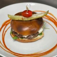 Blender Burger · House seasoned  ground beef, blueberry bacon jam, goat cheese , arugula, sweet and sour onio...