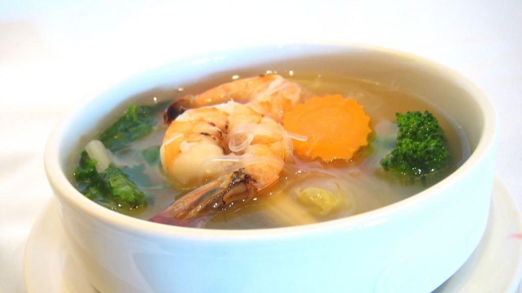 House Soup · Clear soup with carrot, onion and glass noodles.
