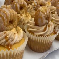 Dulce De Leche Cupcake (1/2 Dozen) · Fluffy Vanilla Bean cupcake topped with silky Dulce de Leche fros.