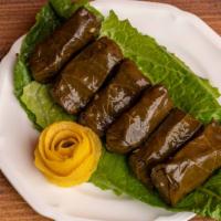 Grape Leaves 6Pc · Rolled vine leaves stuffed with rice, tomato, onion and parsley.