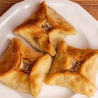 Meat Pie · Homemade dough stuffed with ground beef, tomato, onion & spices