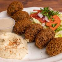 Falafel · 6 pieces. vegetable patties made from chickpeas, fava beans & spices served with hummus, hou...