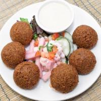 Falafel · Ground fava beans, chick peas and our blend of spices served with vegetables and tahini sauce
