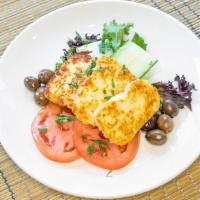 Halloumi · Pan seared halloumi cheese served with ripe tomatoes, cucumbers and olives  (Gluten free)