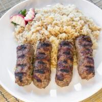 Kafta Kebab · Seasoned ground lamb, with onion, parsley and mint, grilled over an open flame and served wi...
