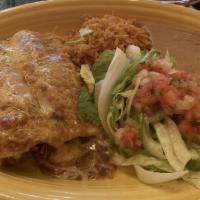 Chicken Enchilada · Stuffed Corn Tortillas, Topped with Cheese and Salsa Rojo, Served with Pico de Gallo, Lettuc...