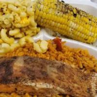 Blackened Salmon Platter · 1 Blackened salmon served on a bed of yellow rice a choice of 2 sides.