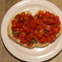 Bruschetta · Bread, cherry tomatoes, basil, garlic, olive oil.