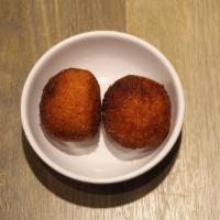 Arancini With Eggplant* · (two fried risotto balls) filled with smoked mozzarella and eggplant.