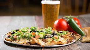 Brewers' Choice Nachos · Choice beef and our special cheese blend, olives, green onions, tomatoes, jalapeños, red oni...