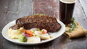 Petite Last Frontiers New York Steak · Our famous N.Y steak as a twelve oz cut seasoned and grilled to your specifications.
