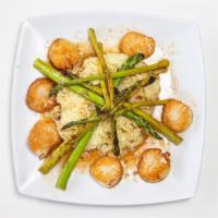 Pan Seared Scallops · Served with herb-lemon butter, over rice and asparagus.