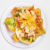 Taco Salad · Crispy tortilla shell filled with fresh crispy lettuce, guacamole, sour cream, chicken breas...