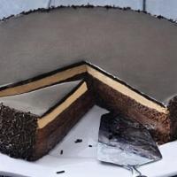 Chocolate Cake  · 1 Slice,
Chocolate cake filled with chocolate cream, hazelnut cream and hazelnut crunch, fin...