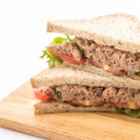 Homemade Chicken & Tuna Salad Sandwich · Our delicious homemade chicken & tuna salad sandwich prepared with lettuce, tomato and onions.