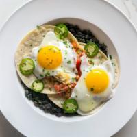 Huevos Rancheros · Eggs sunny side up over two soft corn tacos, shredded cheddar and pico de gallo, fresh jalap...