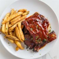 Bbq Pork Ribs · Slow roasted, tender to the bone, basted in sweet and tangy bbq sauce.