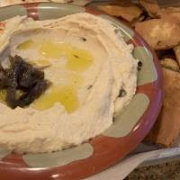 Hummus · Each made with organic ingredients blended fresh to order served with warmed pita, fried pit...