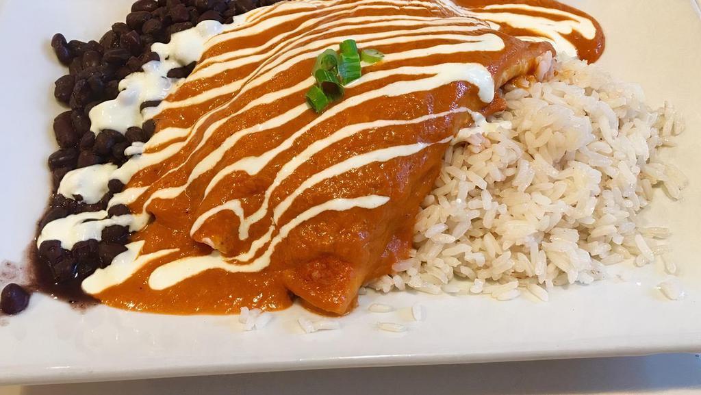 Enchiladas · Baked flour tortillas stuffed with cheese and your choice of chicken, beef, or vegetables topped with salsa ranchera or verde. Served with rice and beans.