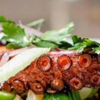 Grilled Octopus* · Spanish octopus is brined overnight and confited in olive oil until tender.  A 3oz portion i...
