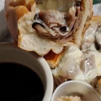French Dip · Sliced beef & provolone baked in the oven and served with au jus. Served on a long roll.