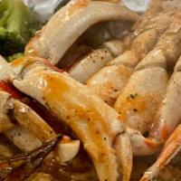 Dungeness Crab Combo · Steamed Dungeness clusters are cooked with a rich butter garlic sauce and served with 12 shr...