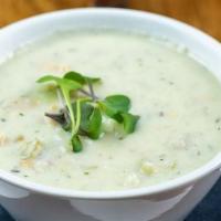 Seafood Chowder · Clams, cod and potatoes with herbs in a creamy broth. Bowl.