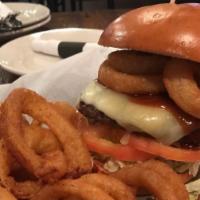 Guinness Bbq Burger · 8 oz angus burger, cheddar cheese, Guinness BBQ sauce, onion rings, lettuce and tomato on a ...