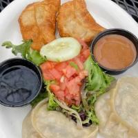 Momos · Four vegetarian Tibetan dumplings served with a side of soy sauce and peanut sauce. Served s...