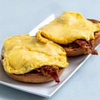 Open Faced Breakfast Sandwich* · Two eggs any style topped with cheddar, with your choice of bacon or avocado, served open fa...
