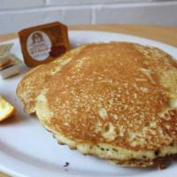 Buttermilk Pancakes · Two large fluffy pancakes served with butter and syrup on the side. Treat yourself and upgra...