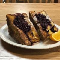 Lemon Ricotta Stuffed French Toast · Tart & creamy, our thick sliced Challah Bread with lemon zest and ricotta cheese filling com...