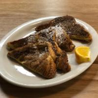 French Toast · Two slices of Challah bread dipped in egg and cinnamon, griddle cooked to golden brown perfe...