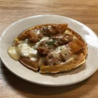 Chicken & Waffles · Crispy chicken tenders on a. malted Belgian waffle with homemade white gravy. Served with sy...