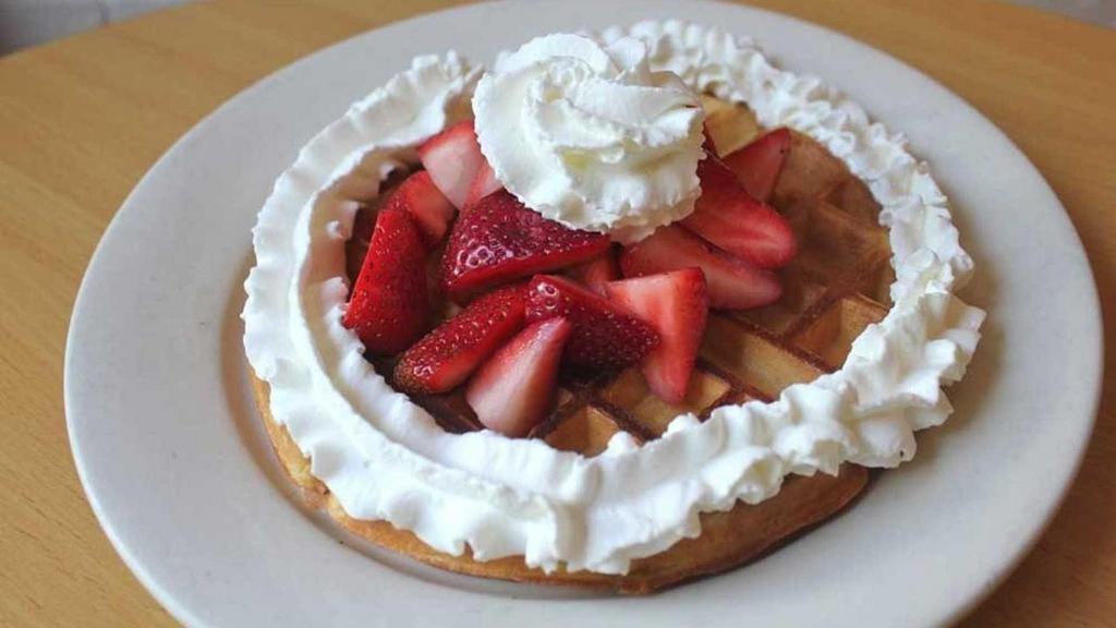 Malted Belgian Waffle · Malted Belgian waffle with your choice of strawberries or bananas. Served with butter and syrup on the side.