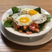 Mediterranean Quinoa Bowl* · Fresh spinach topped with quinoa, feta, tomatoes, chickpeas,. and two sunny eggs