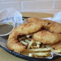 Chicken Strip Basket · Crispy chicken strips served in a basket with French fries and your choice of sauce(s)