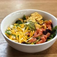 Crunchy Western Ranch · Corn, black beans, cheddar, tortilla chips, tomato, avocado, . and mixed lettuces. Served wi...