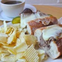 French Dip · Warm roast beef and provolone on an Iggy’s sourdough baguette with Au Jus and horseradish ai...