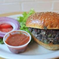 Black Bean Burger · House-made panko-crusted seasoned black bean burger. Served on a sesame bun with lettuce, to...
