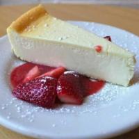 New York Style Cheesecake · Topped with strawberry or blueberry coulis